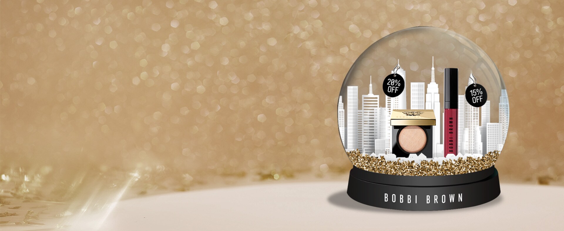 Bobbi Brown golden snow globe with products