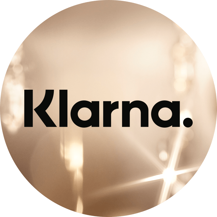 Klarna logo displayed over a bright, sparkling gold background