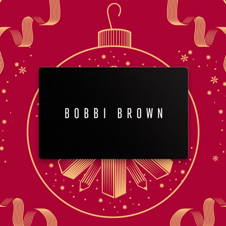 Animation of Bobbi Brown gift cards stacking in a spiral, in front of a red, festive background