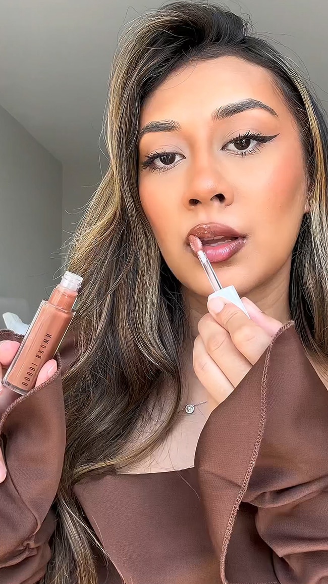 Video showing influencer applying Bobbi Brown lip products to create the Glass Lip trend